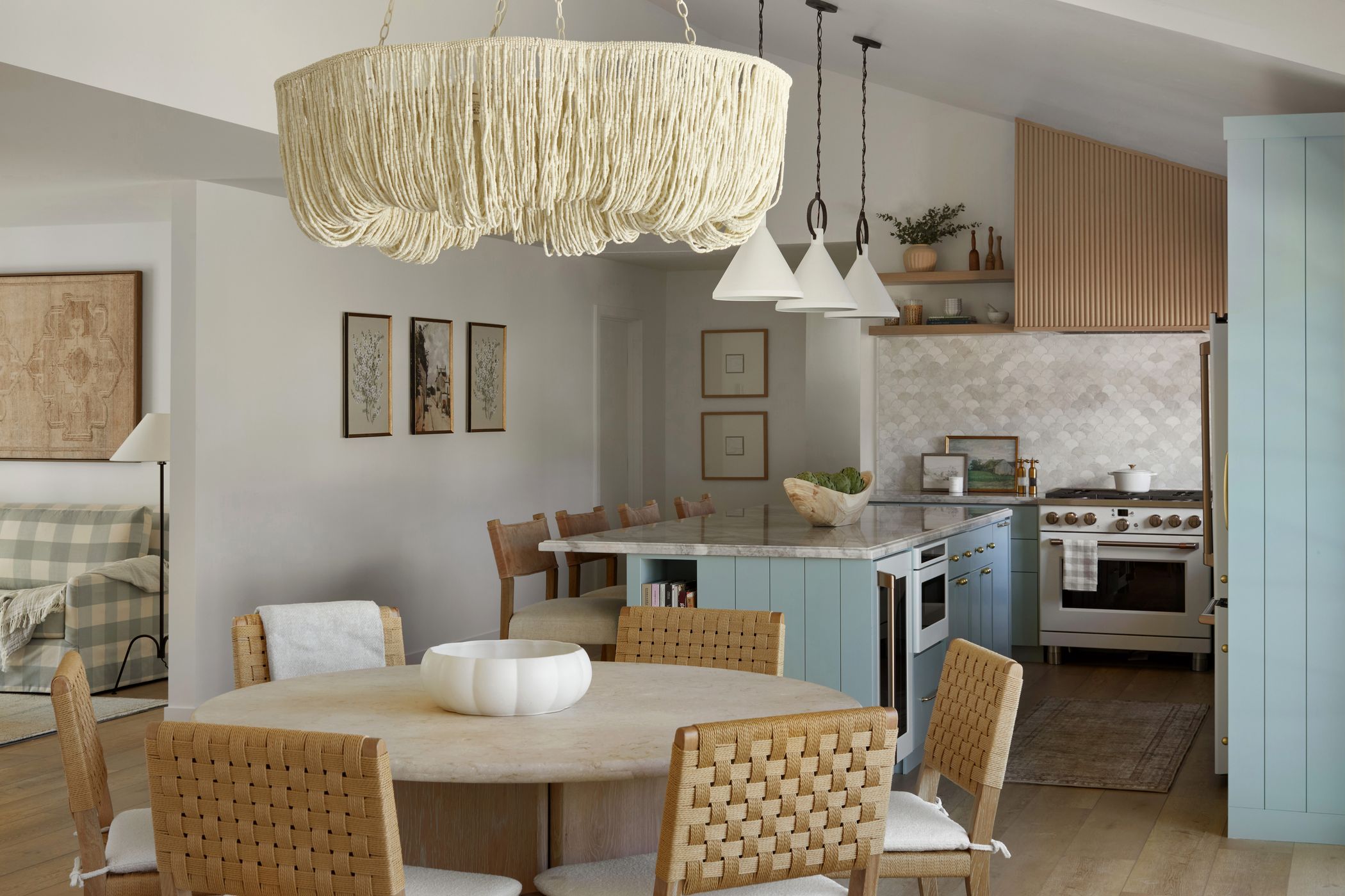 The Boardwalk Beach House kitchen and dining room by Hearth Homes Interiors